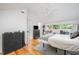Bright bedroom featuring modern decor, comfortable bed and dark wood dresser at 16 Tottenham Ln # 16, Chapel Hill, NC 27517