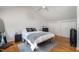 Comfortable bedroom with a sloped ceiling, plush bed and closet doors at 16 Tottenham Ln # 16, Chapel Hill, NC 27517