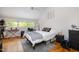 Cozy bedroom with a sloped ceiling, comfortable bed, and ample natural light at 16 Tottenham Ln # 16, Chapel Hill, NC 27517