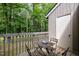 Charming deck with table and chairs, offering a serene outdoor dining space at 16 Tottenham Ln # 16, Chapel Hill, NC 27517