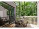 Outdoor deck with seating area overlooking the lush surrounding landscape at 16 Tottenham Ln # 16, Chapel Hill, NC 27517