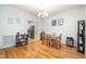 Bright dining room with hardwood floors, a chandelier, and seamless access to the kitchen, creating a welcoming space at 16 Tottenham Ln # 16, Chapel Hill, NC 27517