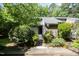 Inviting front entrance with lush landscaping and a well-maintained walkway leading to the front door at 16 Tottenham Ln # 16, Chapel Hill, NC 27517