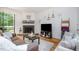 Comfortable living room showcasing a fireplace, hardwood floors, and natural light, ideal for relaxation and gatherings at 16 Tottenham Ln # 16, Chapel Hill, NC 27517