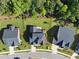 Aerial view showcases the well-manicured lawns, mature trees, and neighborhood layout, highlighting curb appeal at 1612 Commons Ford Pl, Apex, NC 27539