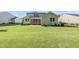 Expansive backyard with a lush lawn, screened porch, and lovely landscaping, great for outdoor activities at 1612 Commons Ford Pl, Apex, NC 27539