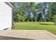 Manicured backyard featuring a lush lawn with beautiful landscaping offering great outdoor space at 1612 Commons Ford Pl, Apex, NC 27539