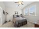 Comfortable bedroom featuring carpet, large windows, a ceiling fan, and neutral paint at 1612 Commons Ford Pl, Apex, NC 27539