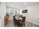 Sunny dining area with a wood table, perfect for intimate meals or Gathering gatherings at 1612 Commons Ford Pl, Apex, NC 27539