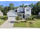 Stunning two-story home boasts a manicured lawn, stone accents, and an attached two-car garage at 1612 Commons Ford Pl, Apex, NC 27539