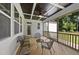 Relaxing screened-in porch, perfect for enjoying the outdoors with comfortable seating at 1612 Commons Ford Pl, Apex, NC 27539