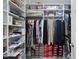 Well-organized walk-in closet featuring ample shelving and hanging space at 1612 Commons Ford Pl, Apex, NC 27539