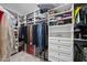 Spacious walk-in closet with custom shelving and hanging racks for optimal organization at 1612 Commons Ford Pl, Apex, NC 27539