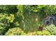 Expansive backyard surrounded by mature trees, offering a private and serene outdoor space at 1641 Regency Dr, Burlington, NC 27215