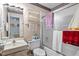 Cozy bathroom with shower-tub combo with sliding door and wallpaper accents at 1641 Regency Dr, Burlington, NC 27215
