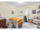 Bright bedroom with neutral walls, natural light and desk space for work from home at 1641 Regency Dr, Burlington, NC 27215
