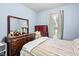 Well-lit bedroom featuring natural light, dresser and soft blue paint at 1641 Regency Dr, Burlington, NC 27215