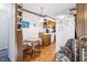 Bright breakfast nook with hardwood floors and an adjacent kitchen with white appliances at 1641 Regency Dr, Burlington, NC 27215