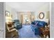Cozy living room featuring comfortable seating, natural light, and a relaxed ambiance at 1641 Regency Dr, Burlington, NC 27215