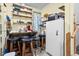 Pantry with shelving, extra refrigerator, and utility space for storing supplies at 1641 Regency Dr, Burlington, NC 27215