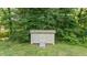 Well-maintained wooden storage shed located in the backyard at 1641 Regency Dr, Burlington, NC 27215