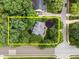 An aerial view of a beautifully landscaped property surrounded by lush greenery and mature trees at 1702 Mcrae Pl, Hillsborough, NC 27278