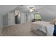 Large bedroom featuring a seating area, large windows and a bed at 1702 Mcrae Pl, Hillsborough, NC 27278