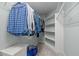Walk-in closet with ample hanging space and shelving, designed for organized storage with carpet floors at 1702 Mcrae Pl, Hillsborough, NC 27278