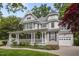 Charming two-story home with a welcoming front porch and an attached garage at 1702 Mcrae Pl, Hillsborough, NC 27278