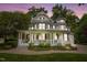 Beautiful two-story home with a spacious front porch and well-manicured landscaping at 1702 Mcrae Pl, Hillsborough, NC 27278