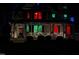 Charming two-story home featuring colorful window lights and decorative wreaths on the inviting front porch at 1702 Mcrae Pl, Hillsborough, NC 27278