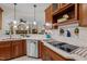 Well-appointed kitchen with updated appliances, sleek countertops, and ample storage space at 1702 Mcrae Pl, Hillsborough, NC 27278