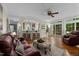 Spacious living room featuring an open floor plan and bar seating leading to the kitchen area at 1702 Mcrae Pl, Hillsborough, NC 27278