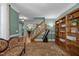 Comfortable living room featuring hardwood floors, telescope, and access to other areas of the home at 1702 Mcrae Pl, Hillsborough, NC 27278