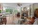 Bright living room with a fireplace, hardwood floors, and access to a deck through sliding glass doors at 1702 Mcrae Pl, Hillsborough, NC 27278