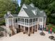 Elegant pool house features a spacious veranda with picturesque views offering a perfect spot for relaxation at 1702 Mcrae Pl, Hillsborough, NC 27278