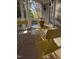 Charming porch with yellow patio furniture and potted plants, creating an inviting outdoor space at 1702 Mcrae Pl, Hillsborough, NC 27278