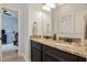 Bathroom with double vanity featuring granite countertop and a view to another room at 18 Heathgreen Dr, Clayton, NC 27527