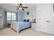 Charming bedroom with a comfortable bed and bench seat to take in the natural light at 18 Heathgreen Dr, Clayton, NC 27527