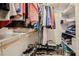 Walk-in closet providing ample storage with shelving, hanging rods, and organizers for shoes and accessories at 18 Heathgreen Dr, Clayton, NC 27527