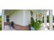 Relaxing front porch with seating and potted plants at 18 Heathgreen Dr, Clayton, NC 27527
