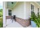 Comfortable front porch with a seating area, brick details, and view of the outdoors at 18 Heathgreen Dr, Clayton, NC 27527