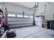 Clean and organized two-car garage with ample storage space and an automatic door opener at 18 Heathgreen Dr, Clayton, NC 27527