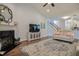 Comfortable living room with fireplace, tv, and hardwood floors at 18 Heathgreen Dr, Clayton, NC 27527