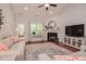 Cozy living room features a fireplace, vaulted ceiling, and lots of natural light at 18 Heathgreen Dr, Clayton, NC 27527