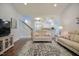 Spacious living room featuring hardwood floors, neutral paint colors, and staircase to second level at 18 Heathgreen Dr, Clayton, NC 27527