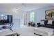 Comfortable living area with a sofa, TV and seating area with light neutral colored walls at 18 Heathgreen Dr, Clayton, NC 27527