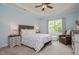 A serene bedroom features a tray ceiling, neutral decor, and lots of natural light at 18 Heathgreen Dr, Clayton, NC 27527