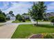 Charming neighborhood with well-maintained homes, mature trees, and beautiful landscaping at 18 Heathgreen Dr, Clayton, NC 27527