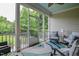 Inviting screened porch with comfortable seating overlooking the landscaped backyard at 18 Heathgreen Dr, Clayton, NC 27527